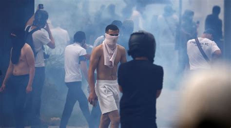 France unrest: Riots spread, thousands march in memory of shot teenager